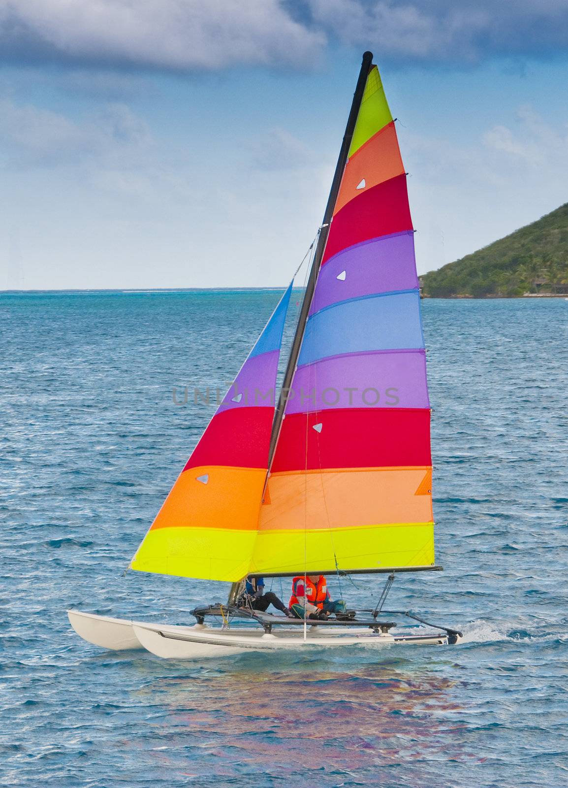 Sailing boat - a catamaran off a caribbean coast