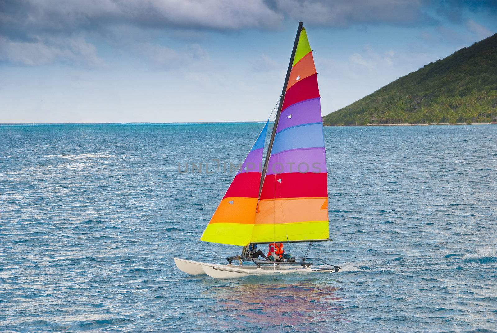 Sailing boat - a catamaran off a caribbean coast