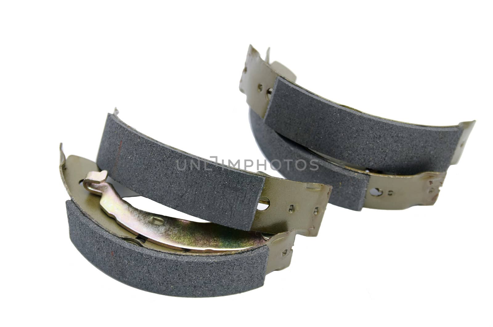 set of brake pads for a car on a white background