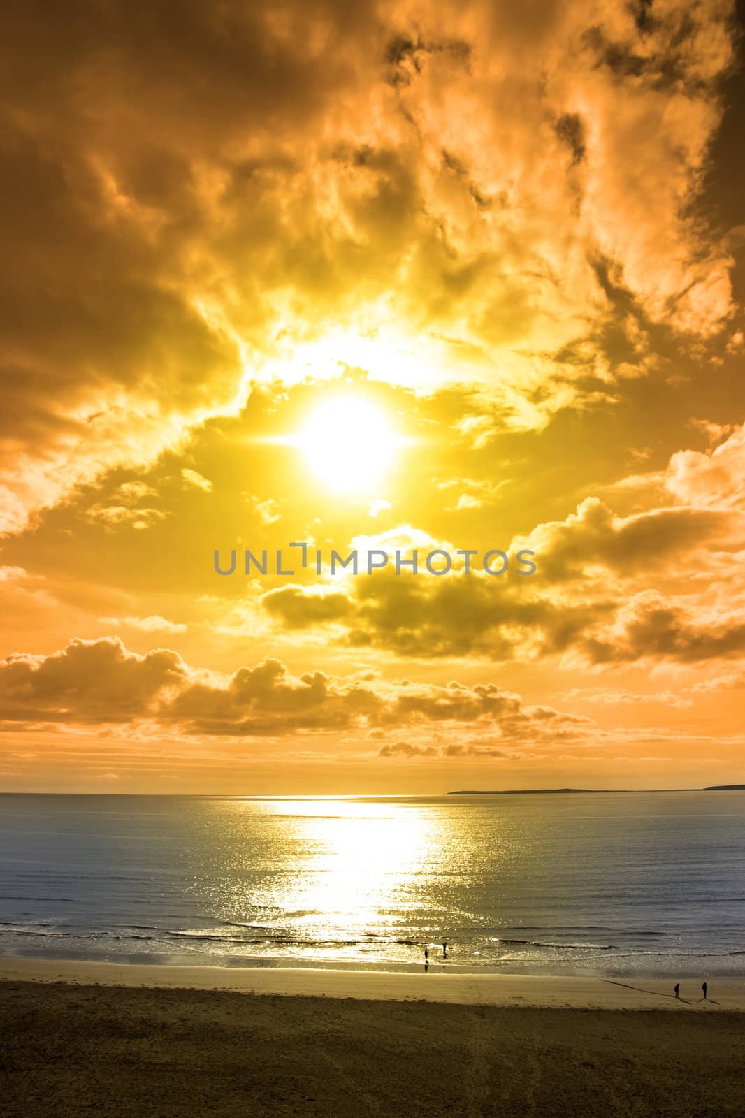 tourists walking on Ballybunion beach in county Kerry Ireland on a beautiful summers day