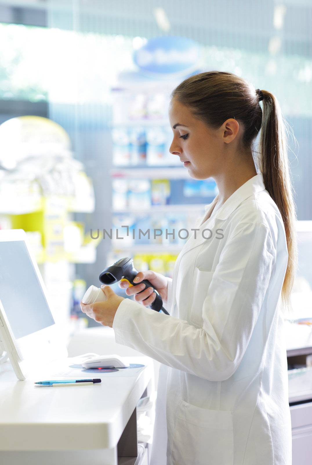 Pharmacy: Scanning a Pill Bottle by stokkete