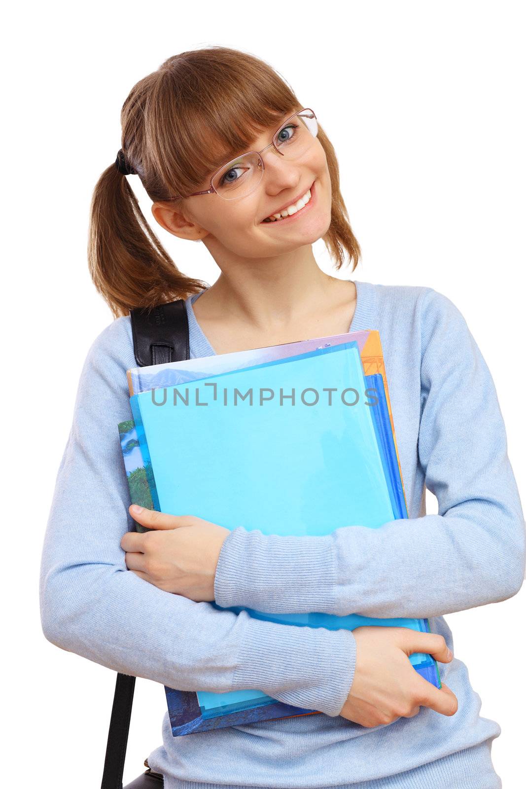 Happy smiling student standing and holding books