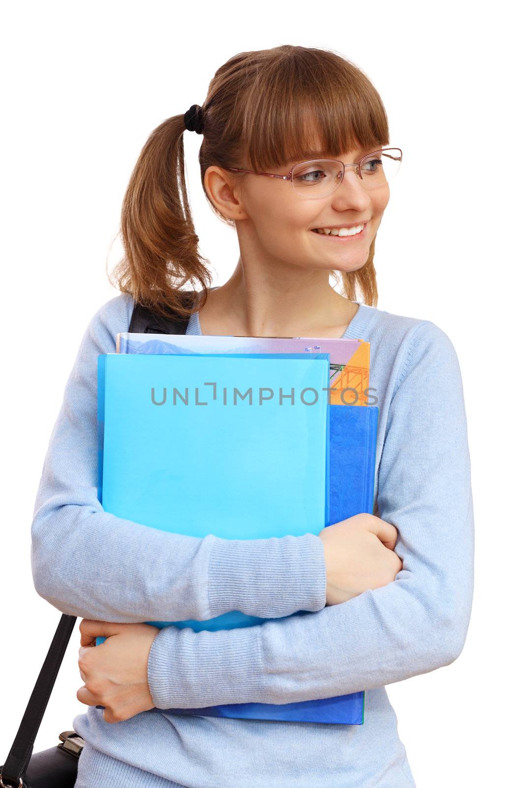 Happy smiling student standing and holding books