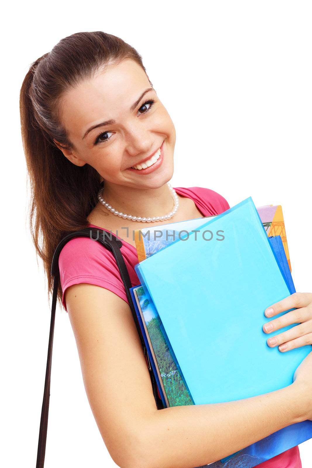 Happy smiling student standing and holding books