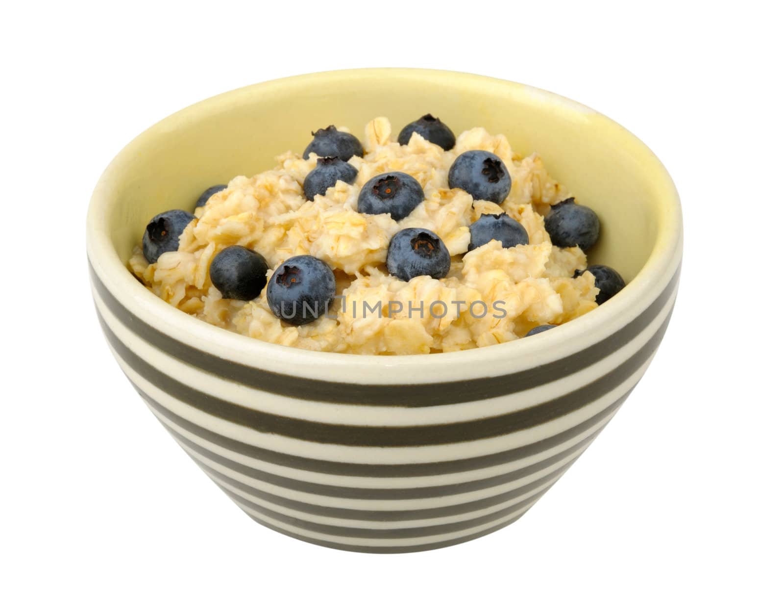 Oatmeal with blueberries in a bowl isolated on white background