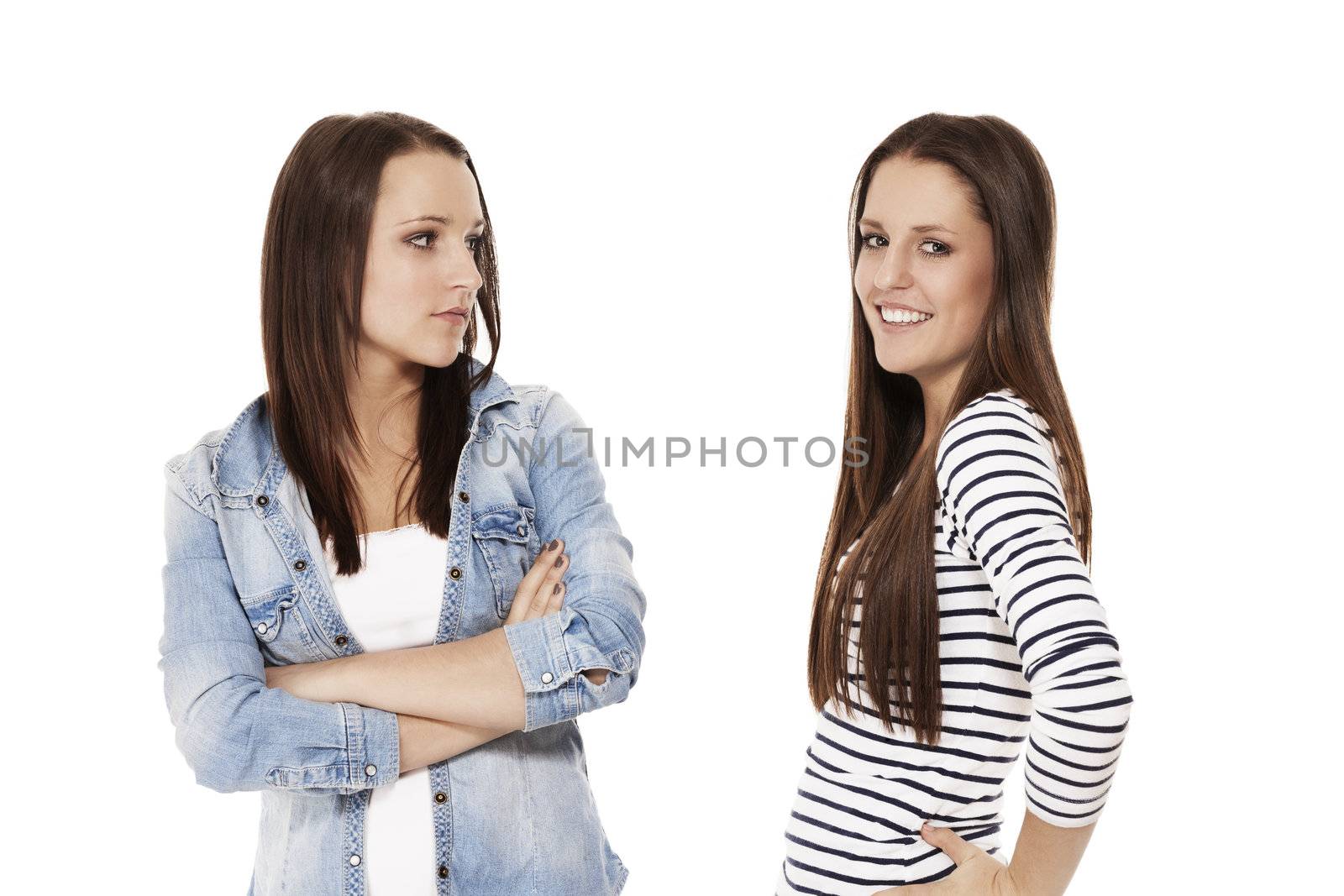 one happy and one upset teenager on white background