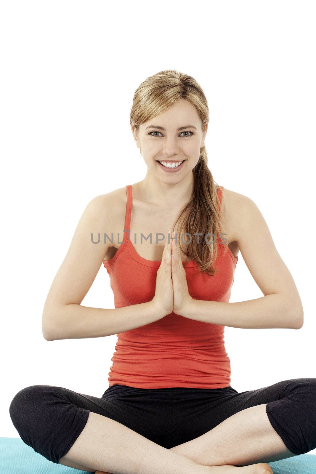 cute fitness woman exercising yoga sitting on a blue mat on white background