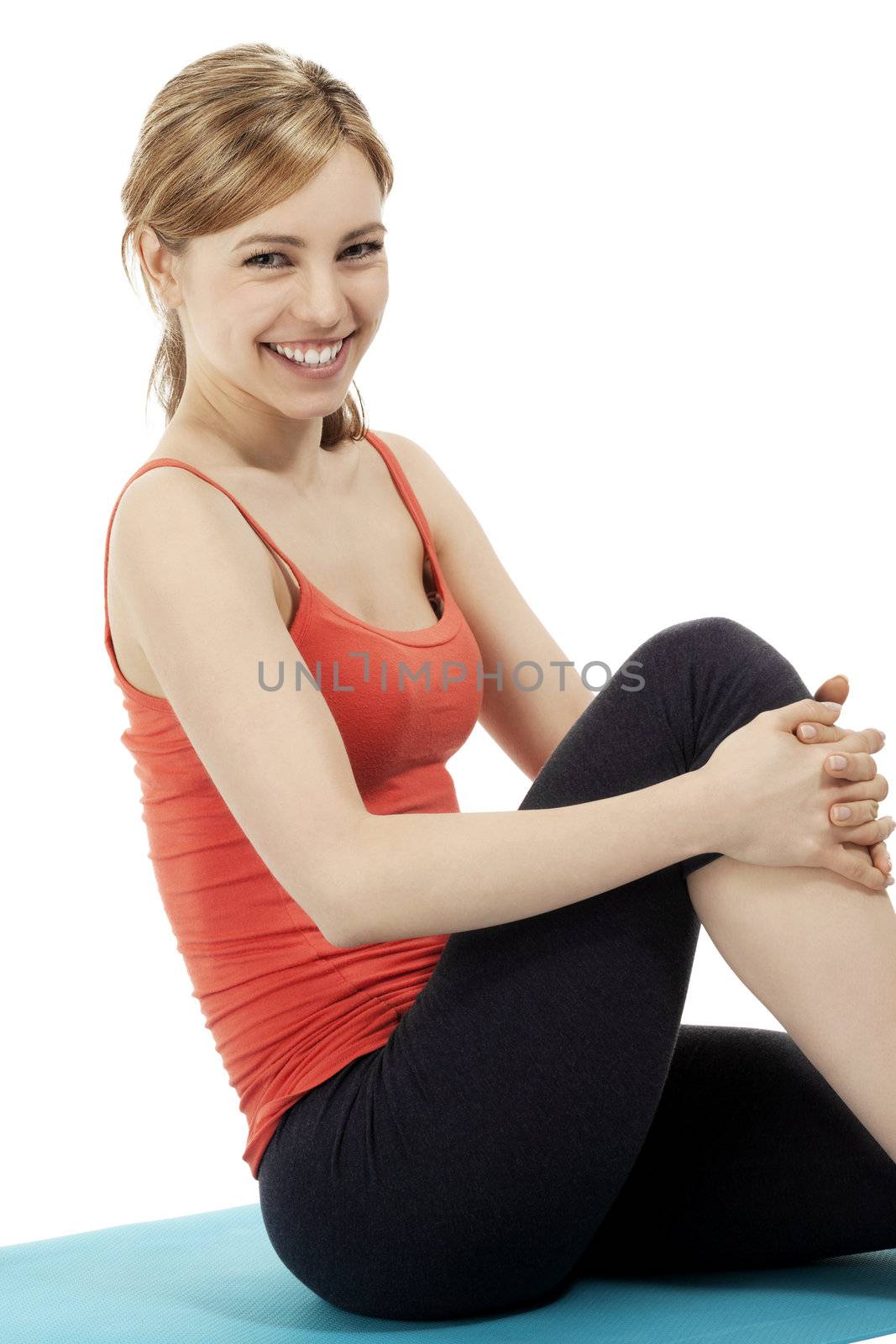 happy young fitness woman making a pause on white background