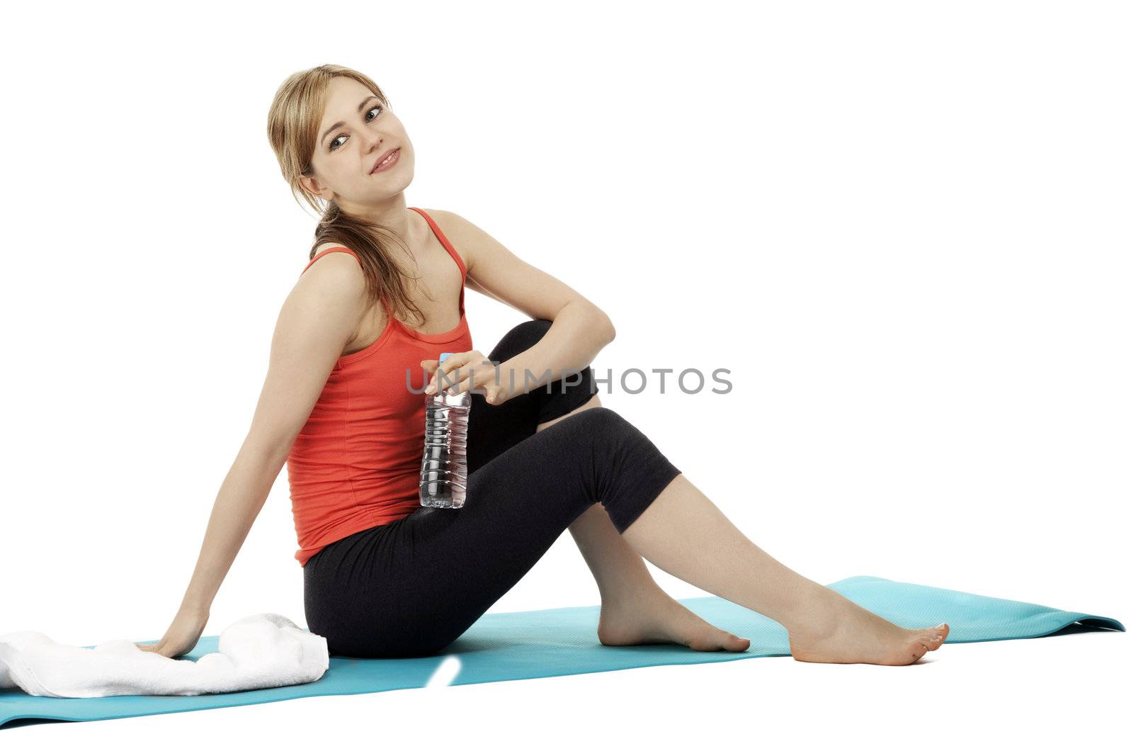 fitness woman with a bottle of water making a break on white background
