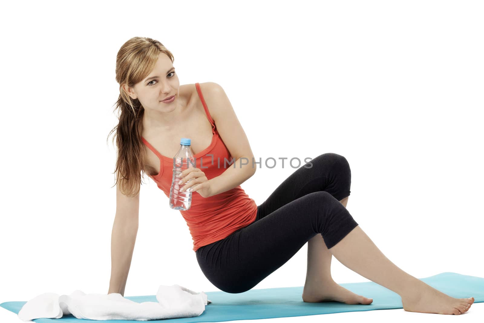 young blonde fitness woman about to sit for a break on white background