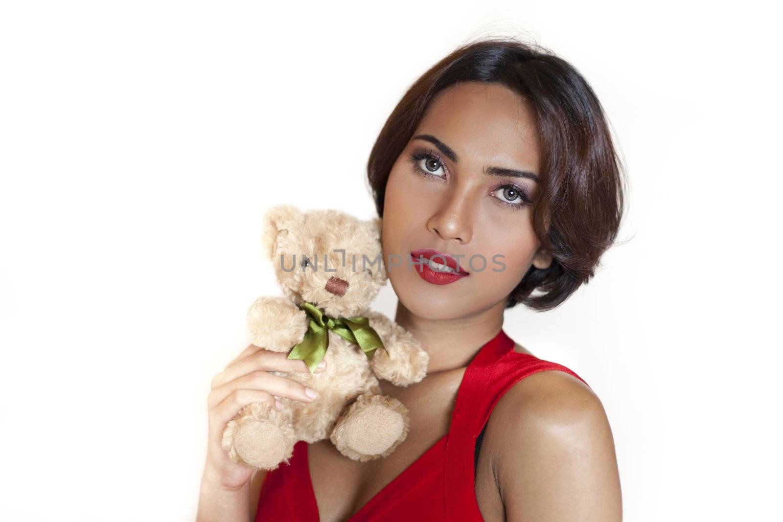Beautiful sexy asian woman  wearing a red dress with a cute teddy bear