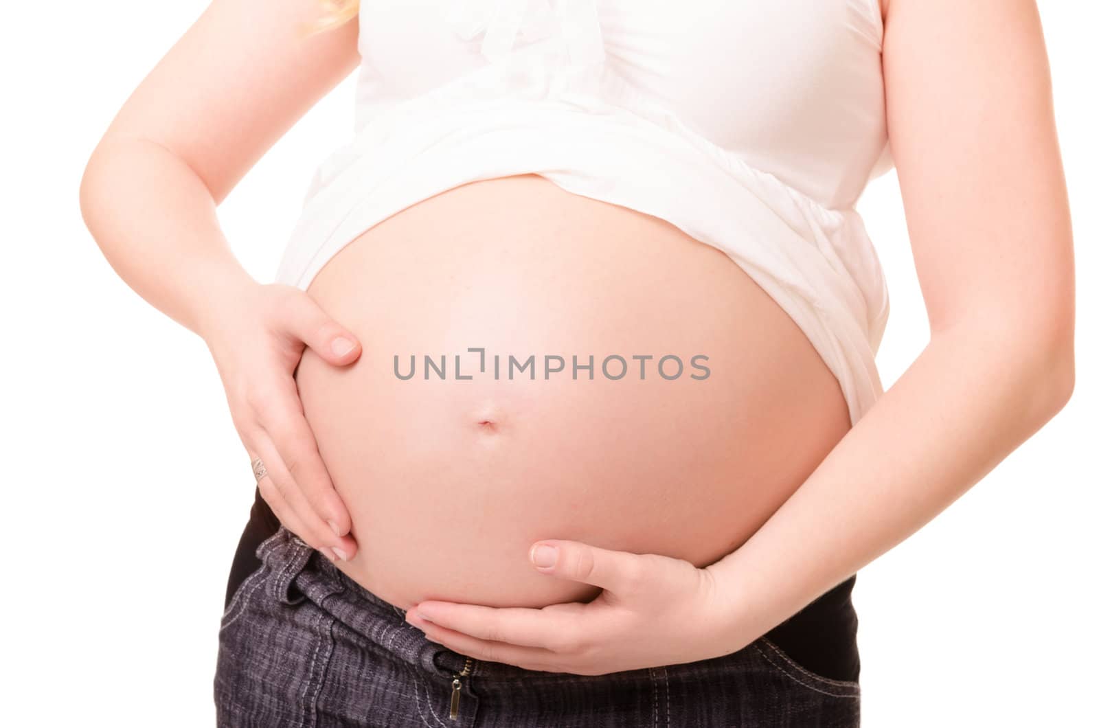 Pregnant woman hugs her belly isolated on white background