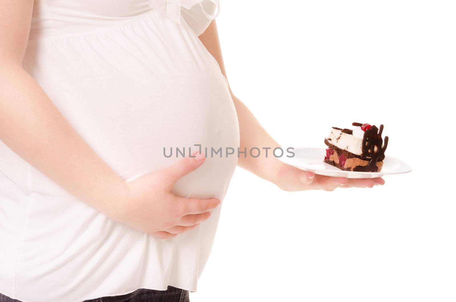 Pregnant woman hold a sweet cake on a plate. Isolated on white background