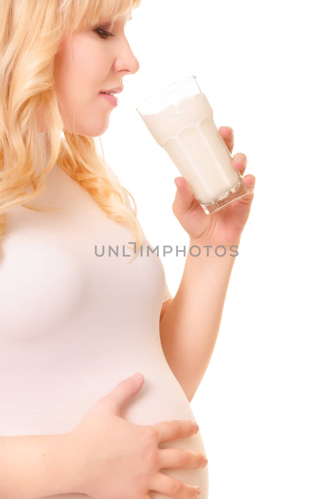 Pregnant woman with a glass of milk drink by iryna_rasko