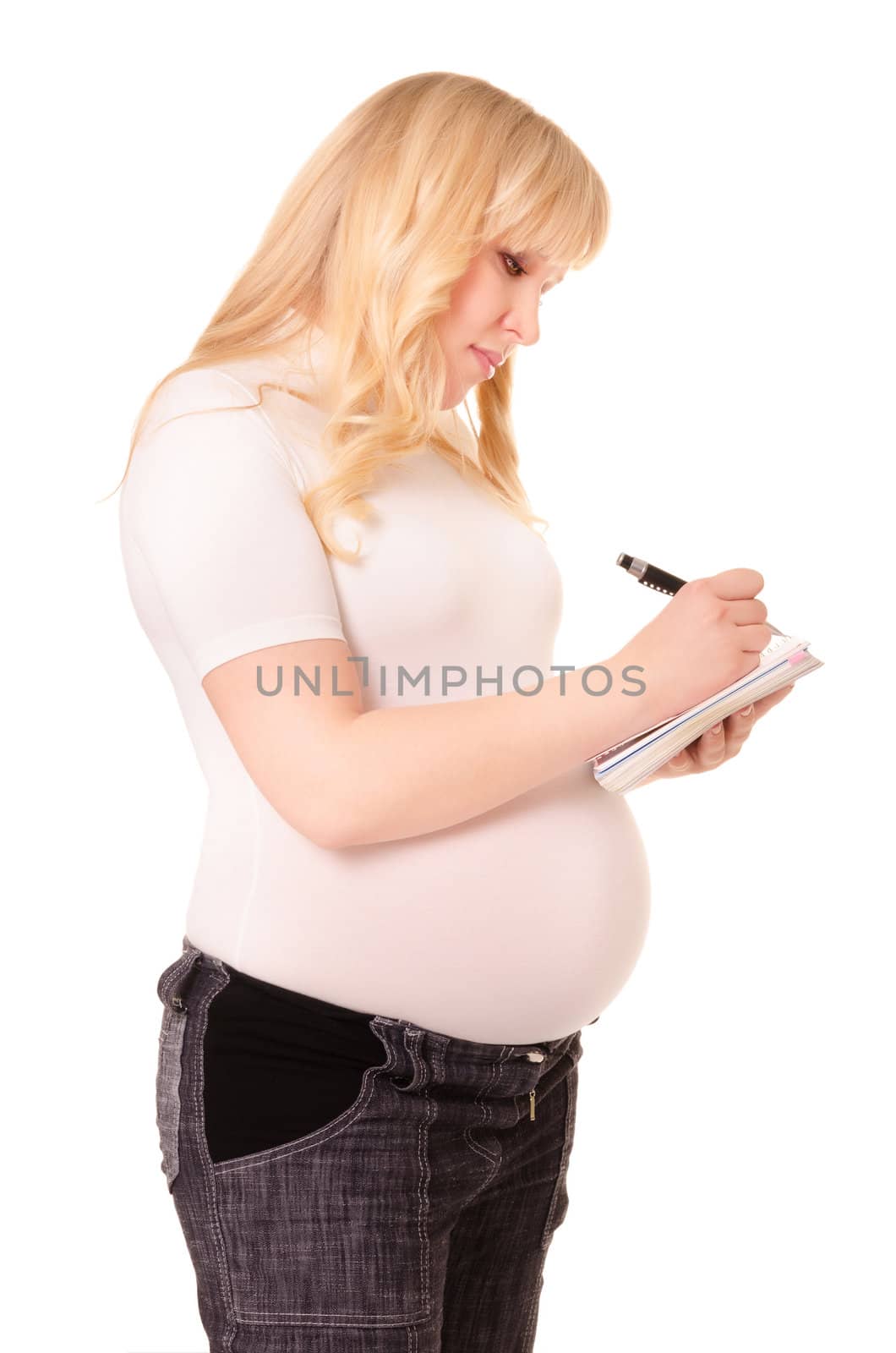 Pregnant woman makes notes isolated on white background