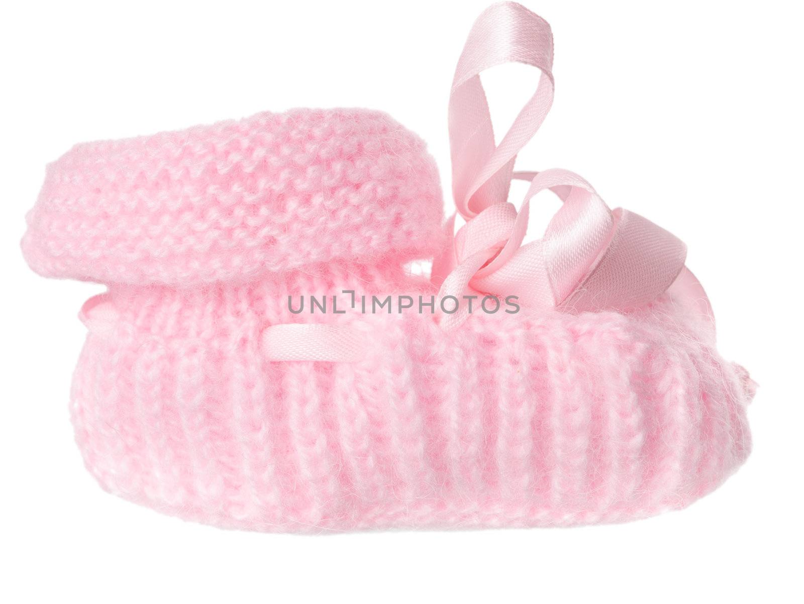 One pink baby bootee with a bow, isolated on a white background