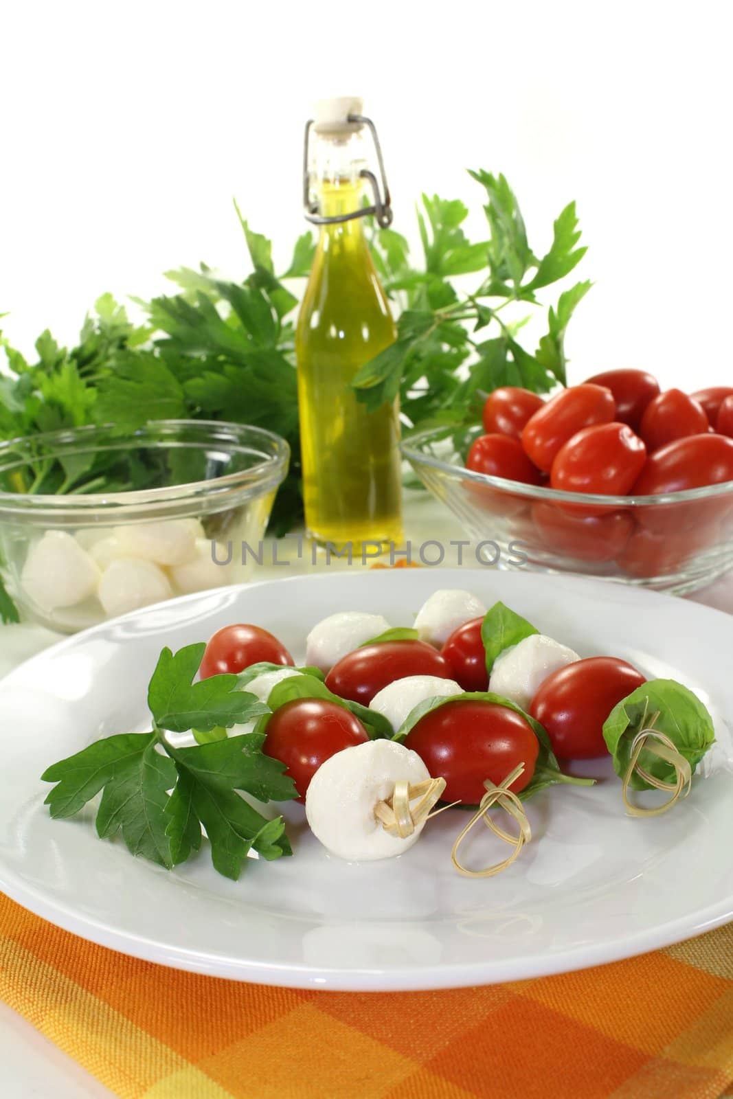 small skewers with mozzarella, tomato and basil