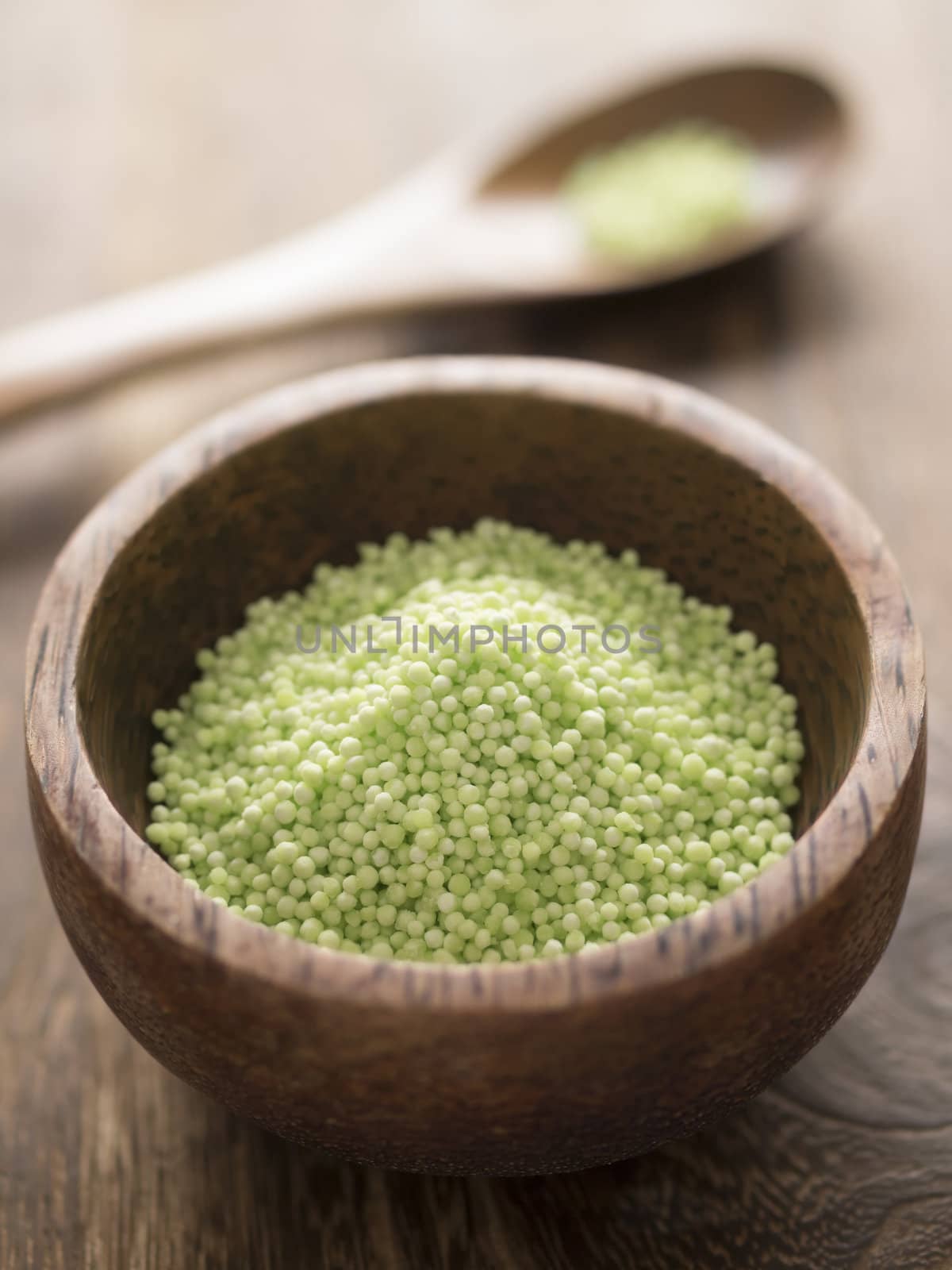 close up of a bowl of green sago pearls