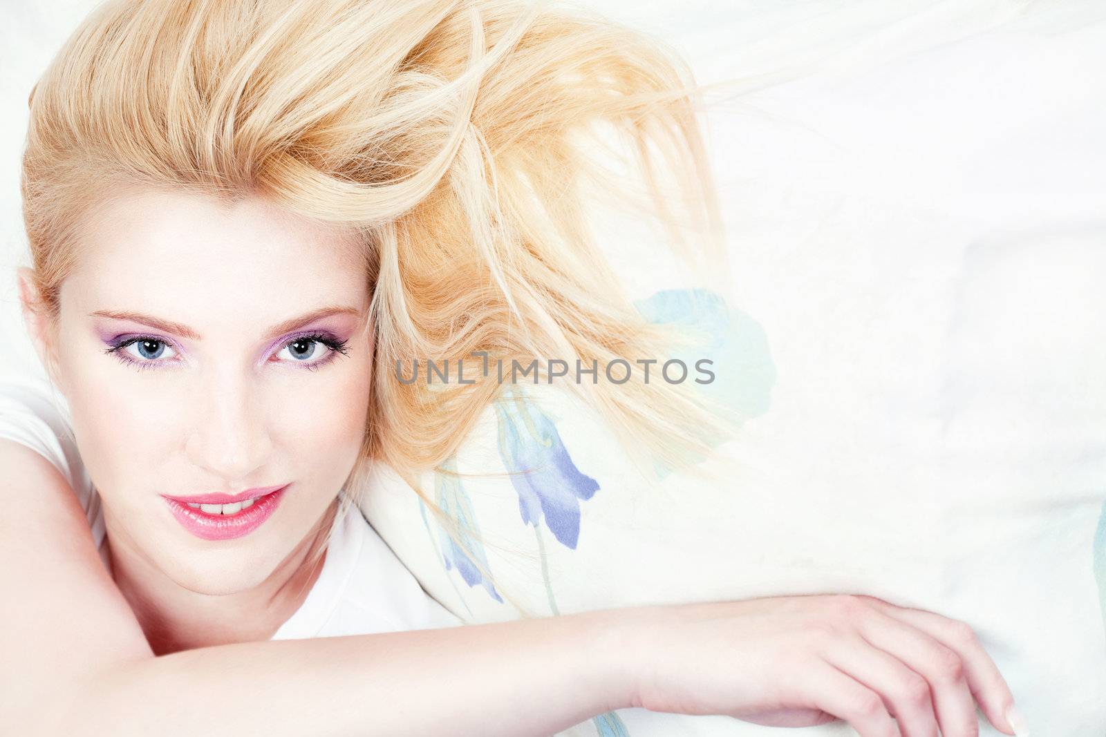 Pretty woman on pillow by imarin
