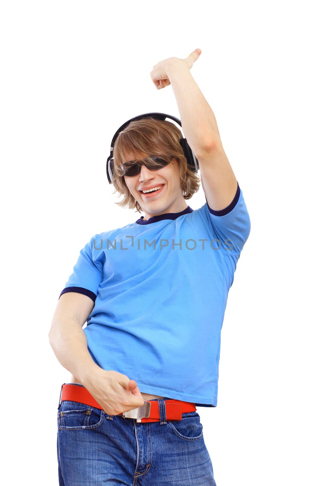 Happy smiling young man dancing and listening to music