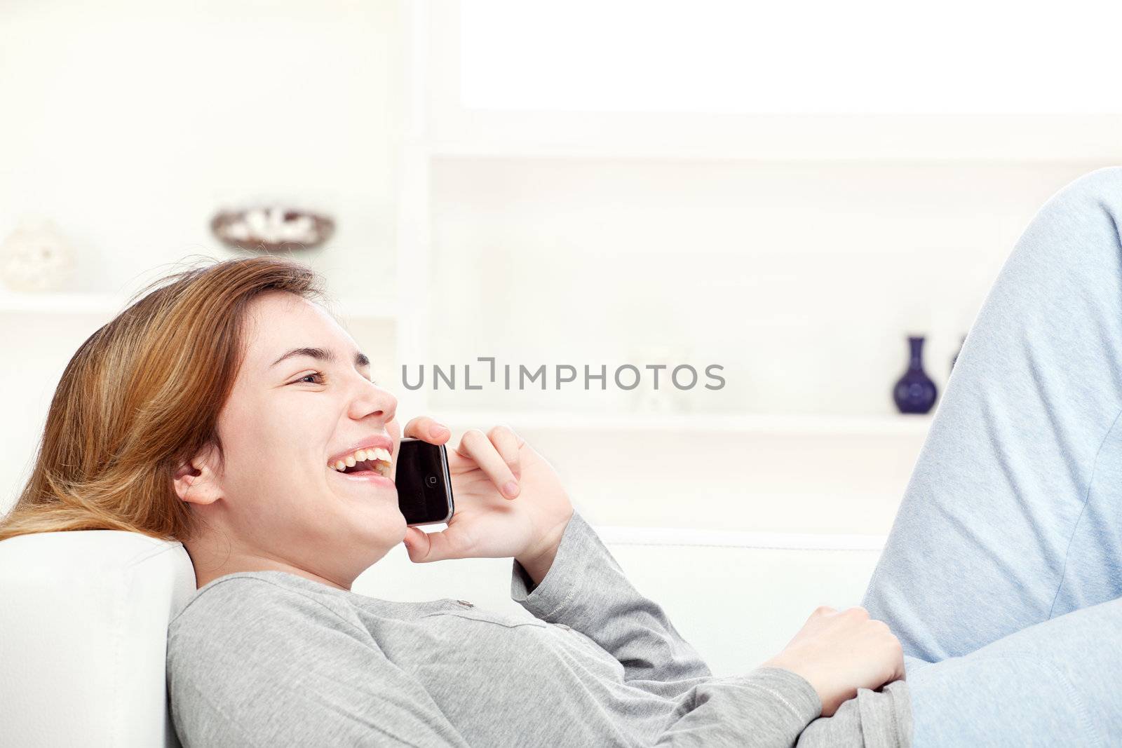 woman have joyful talk over telephone by imarin