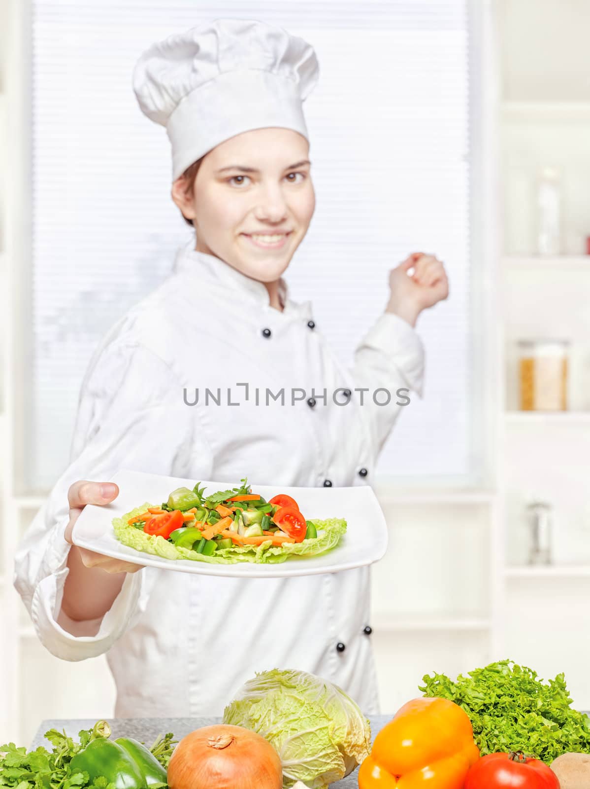 chef offering vegetarian meal by imarin