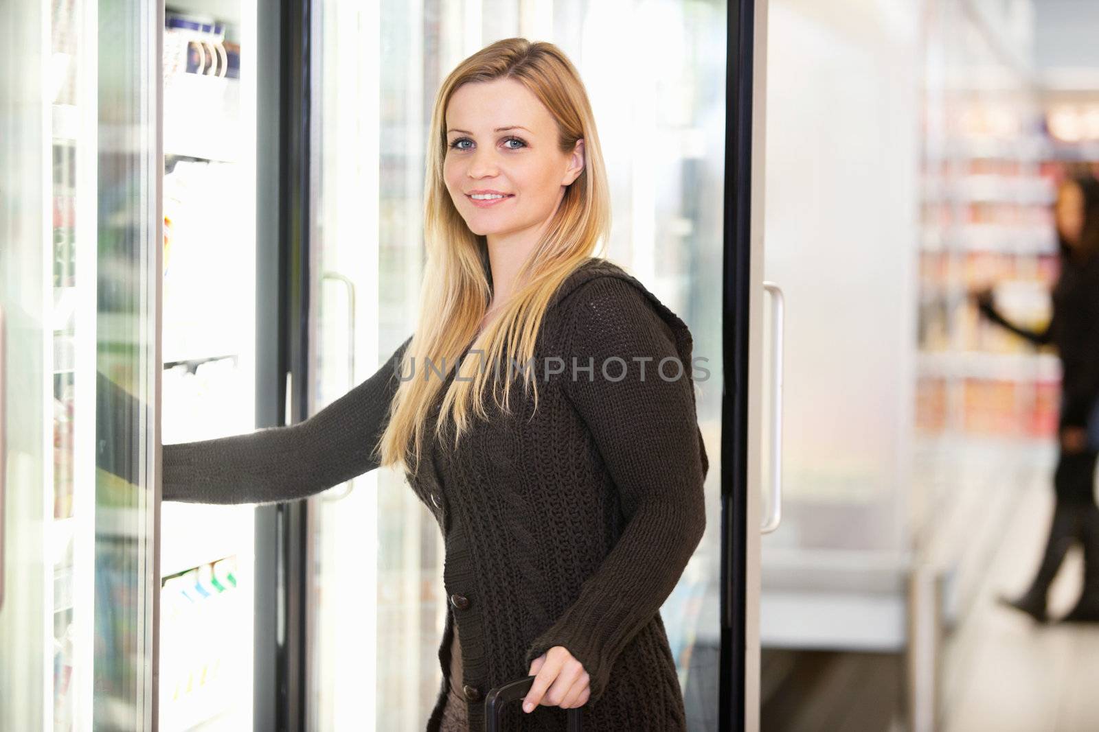 Woman by Grocery Store Cooler by leaf