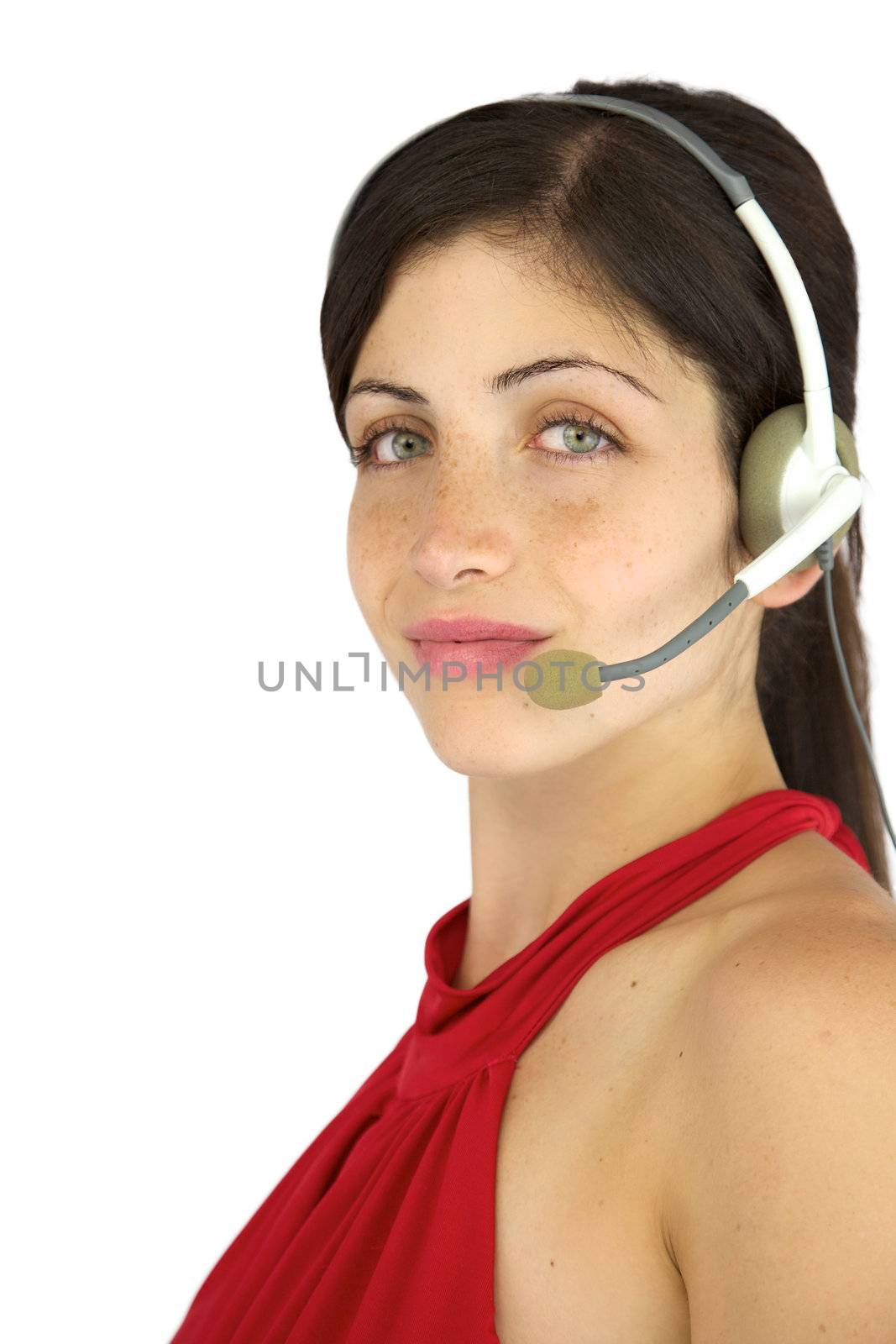 Gorgeous female model with headset working smiling with freckles and green eyes