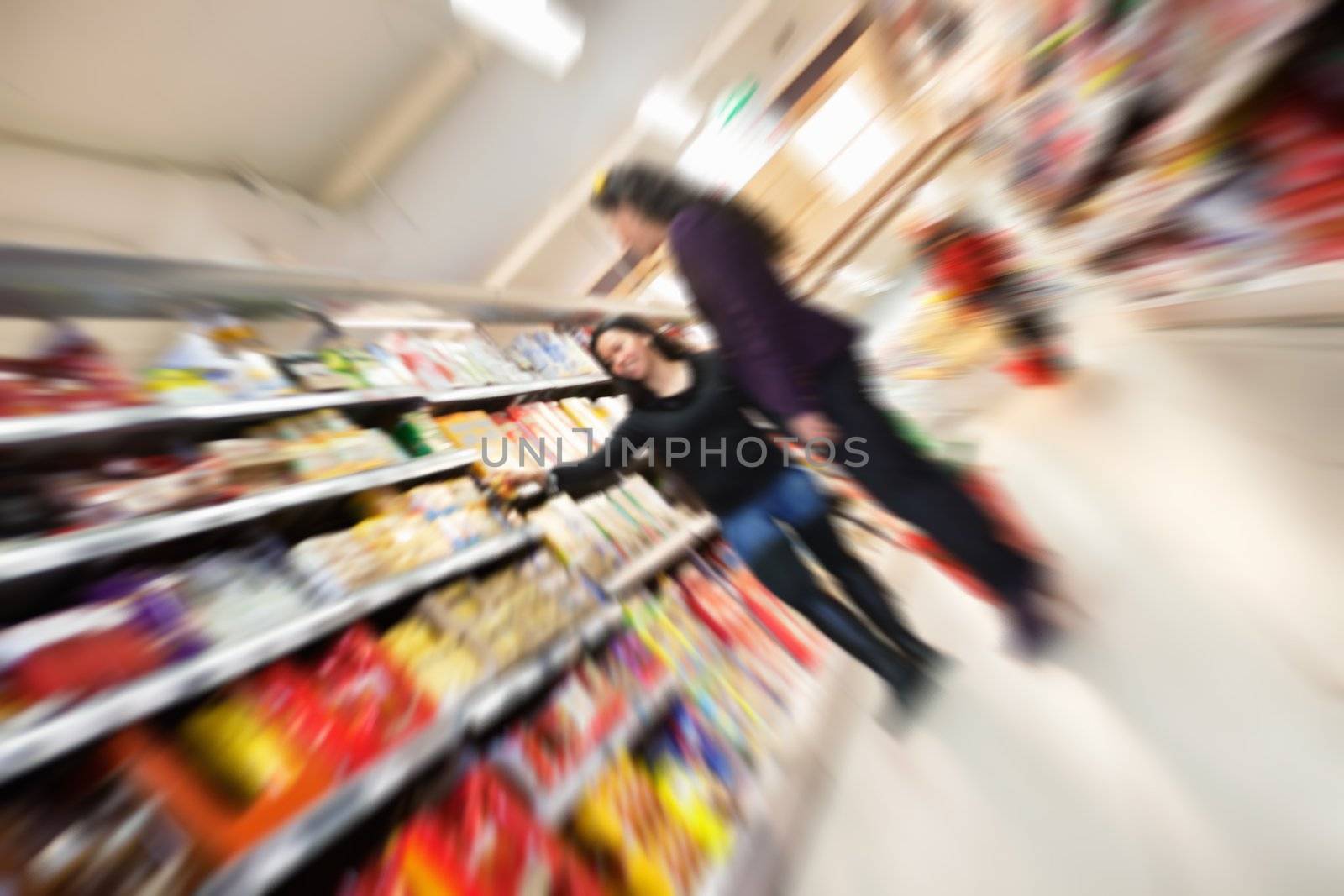 Tilted blur image of women shopping in shopping in shopping centre