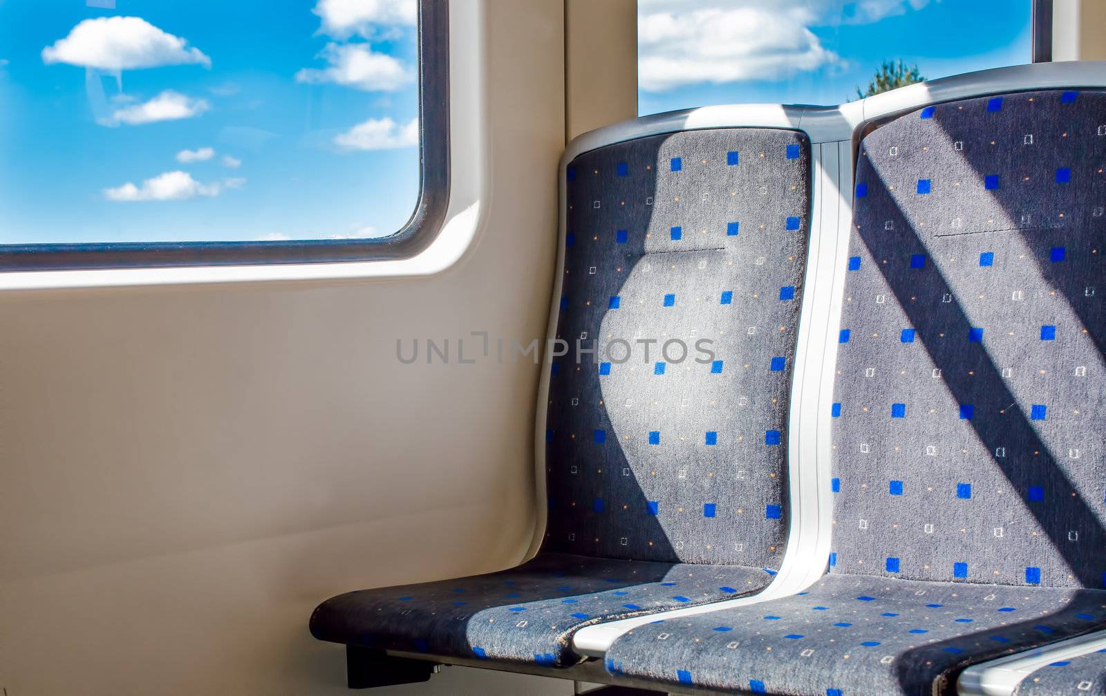 Two empty seats in the subway