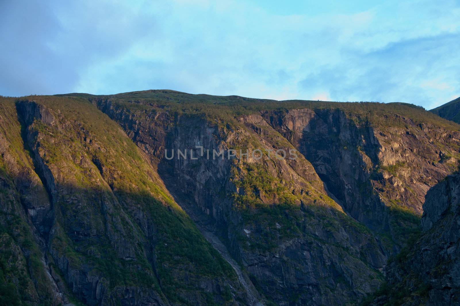 Norwegian mountains in the rays of the setting sun