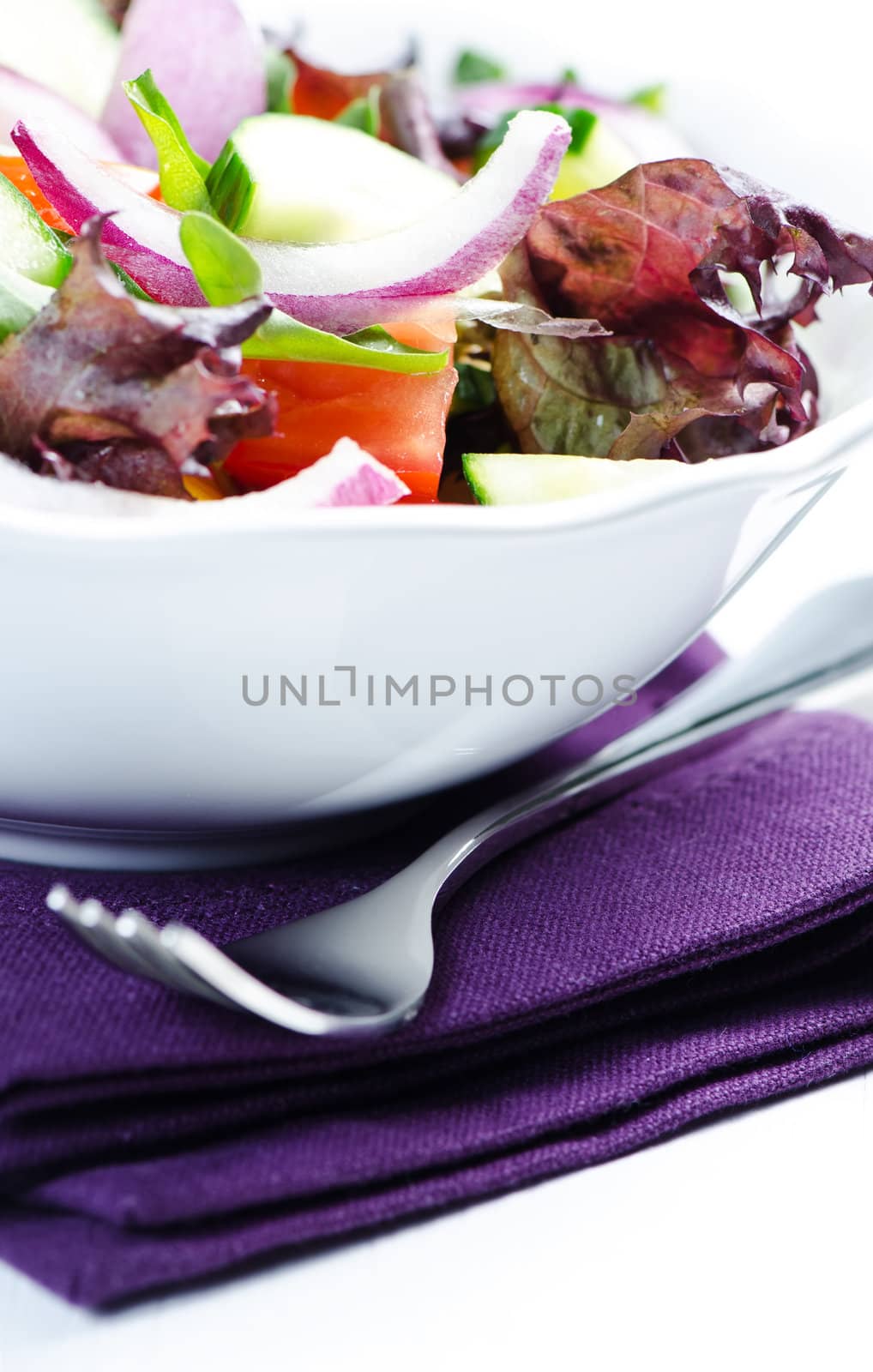 Salad on a purple napkin