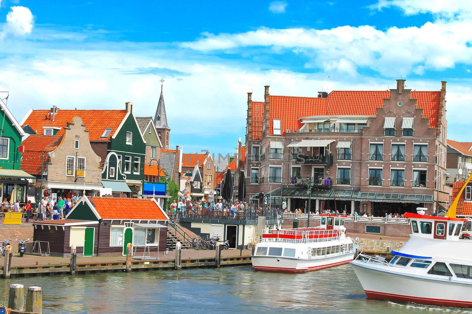 Tourist boat in the port of Volendam. Netherlands  by NickNick