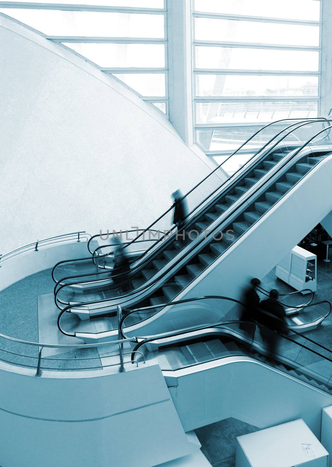 Architectural detail of escalator and people