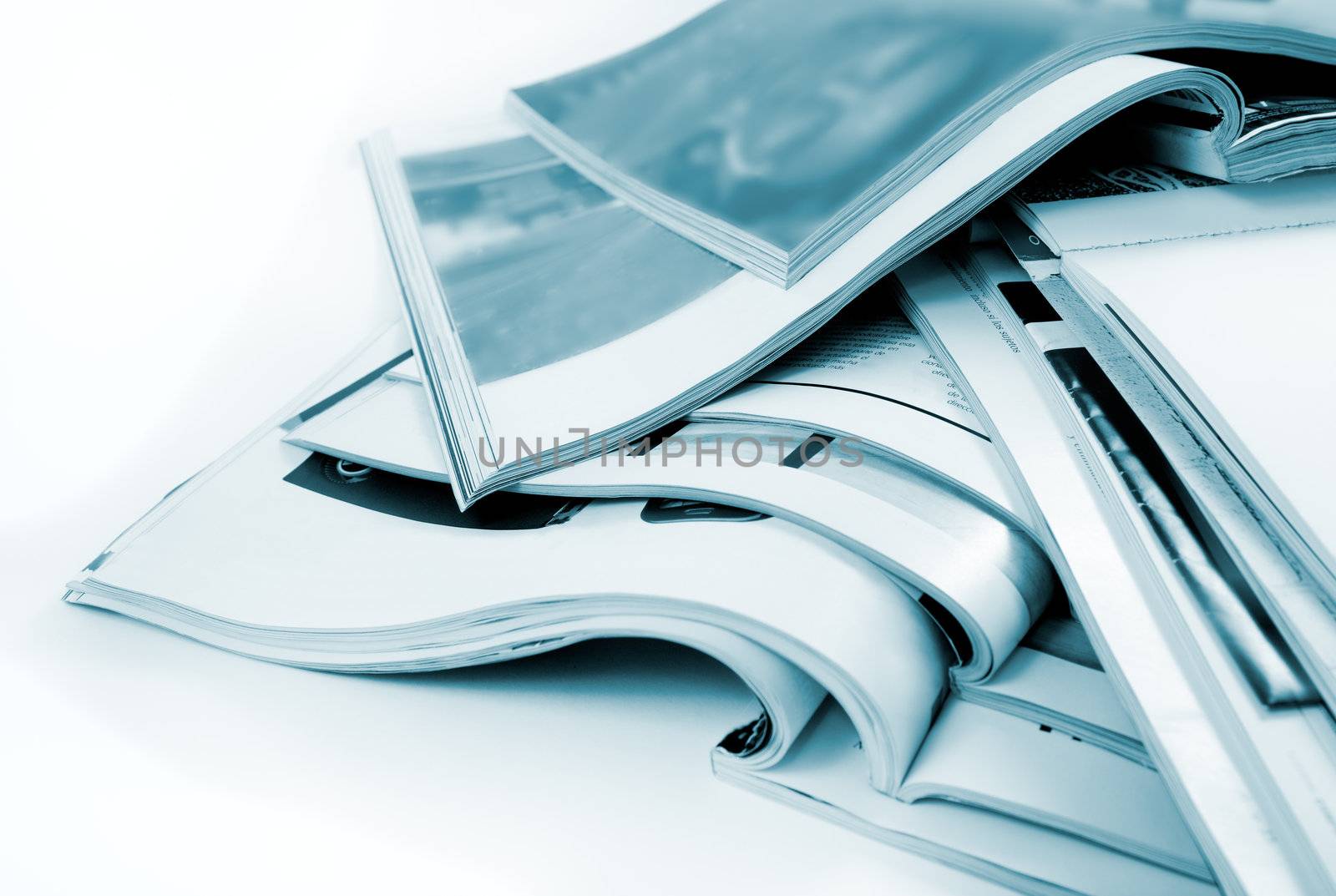 Detail of several magazines and books isolated in white