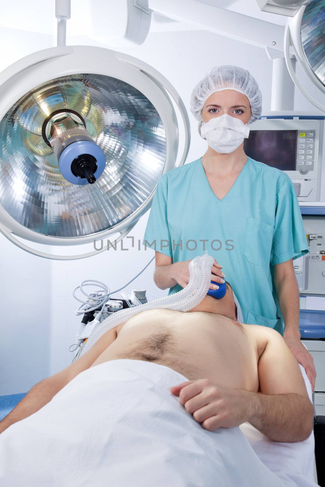 Female doctor applying gas mask to a patient in the hospital