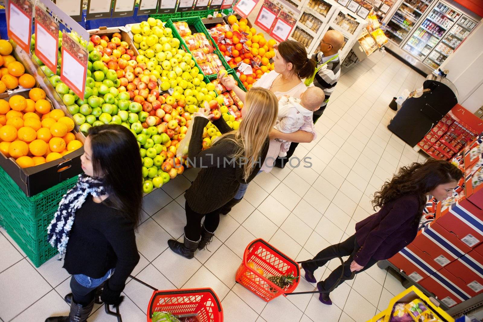 High angle view of busy people shopping in supermarket