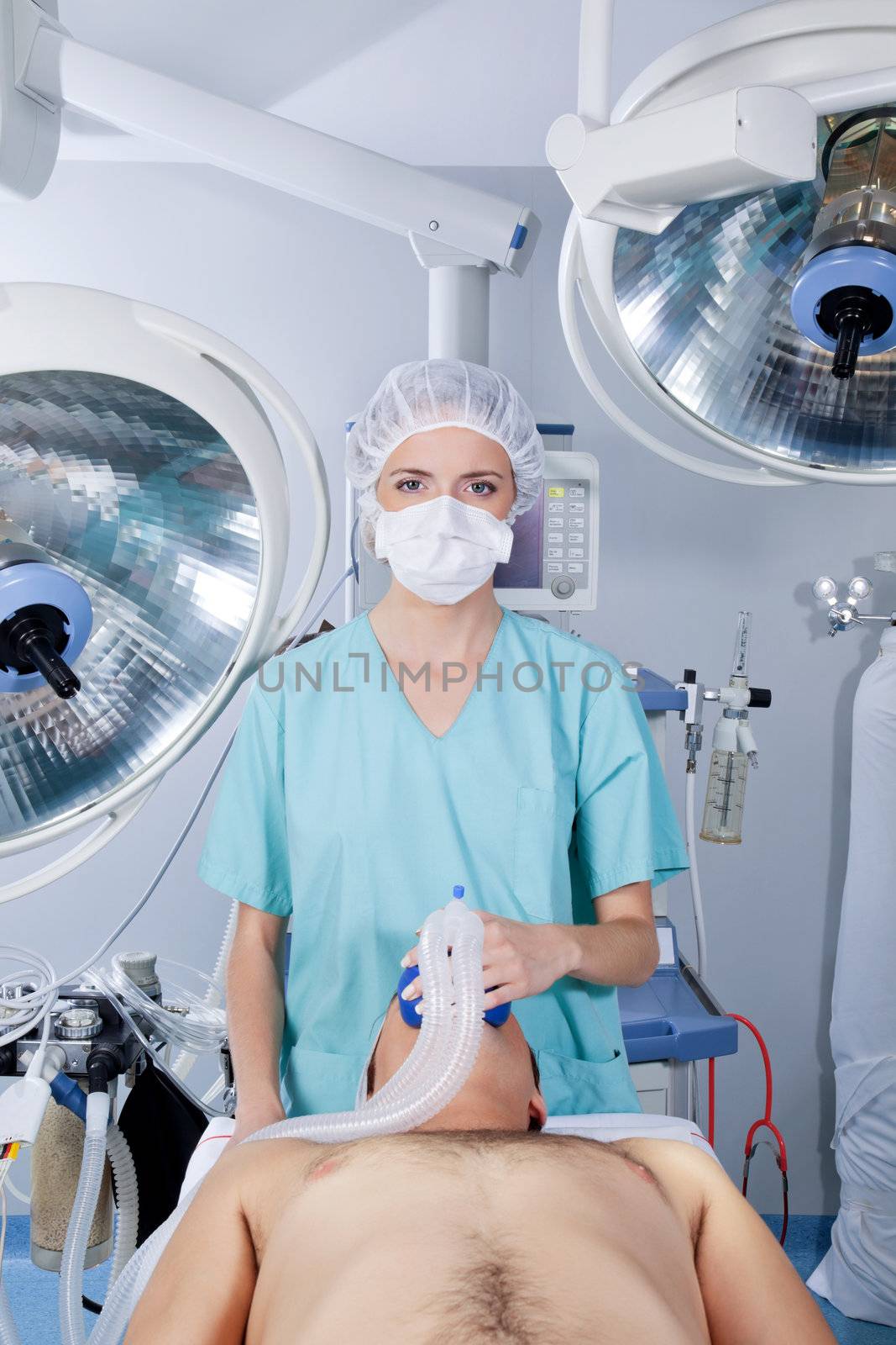 Doctor applying gas mask to a patient by leaf