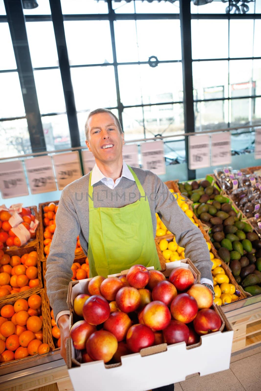 Supermarket Owner with Fresh Produce by leaf