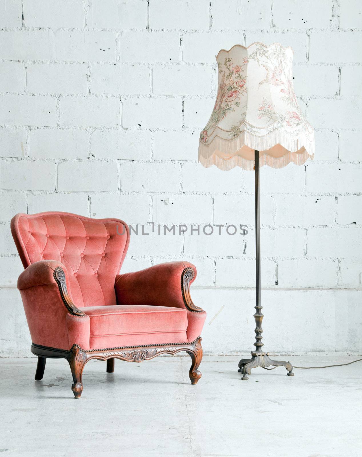 Pink classical style Armchair sofa couch in vintage room with desk lamp