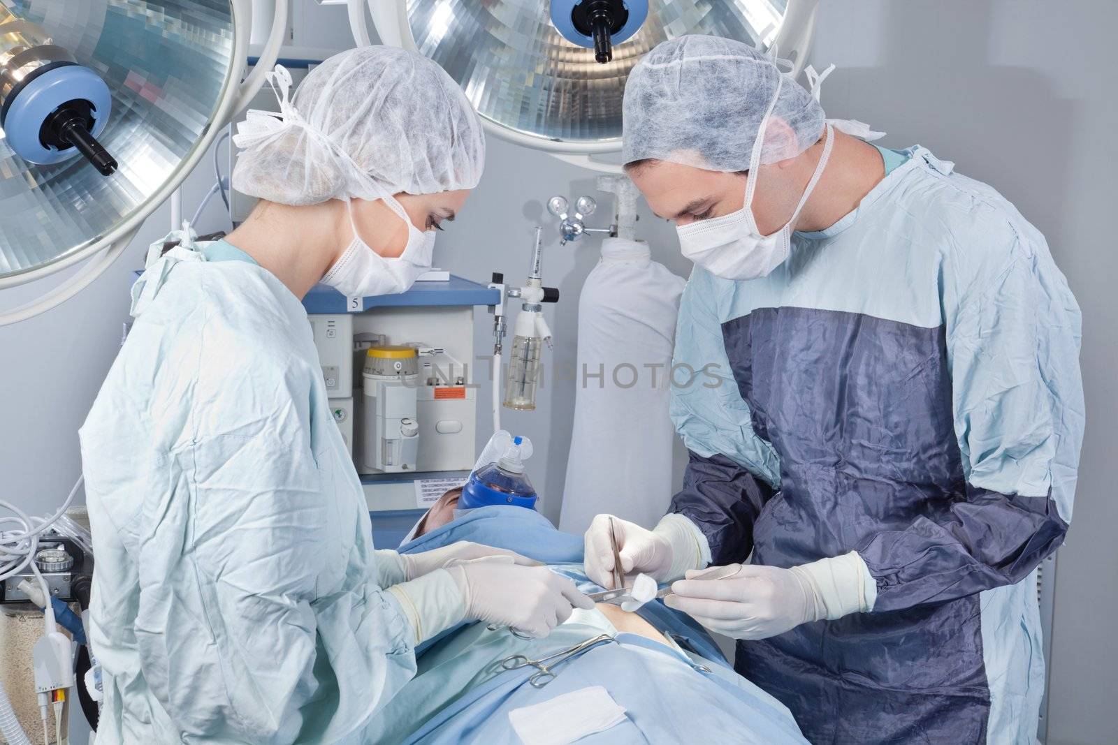 Surgeon operating the patient in operation room in hospital