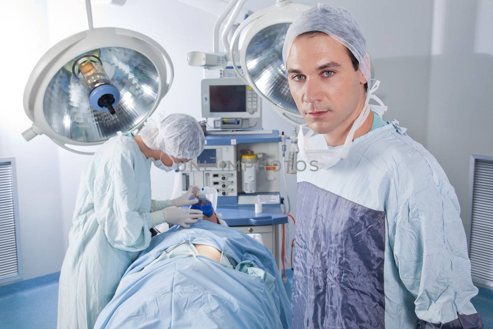 Male doctor confident while surgery by leaf