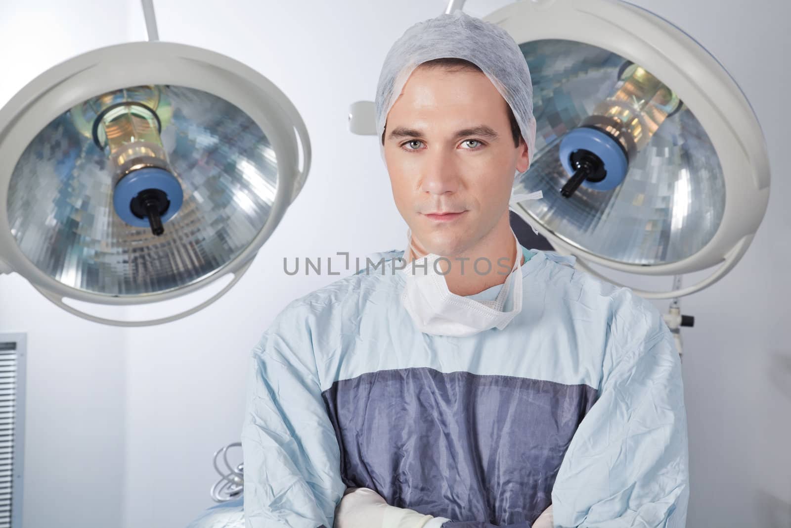 Close-up portrait of confident young male doctor