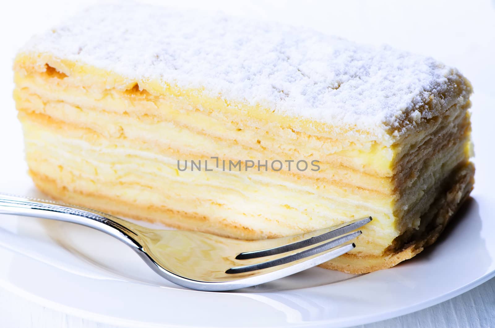 Delicious layered piece of cake close up