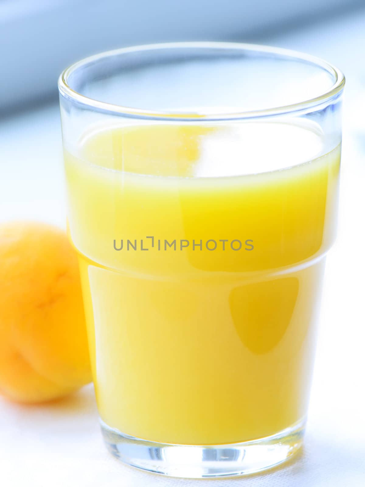 Glass of apricot juice close up