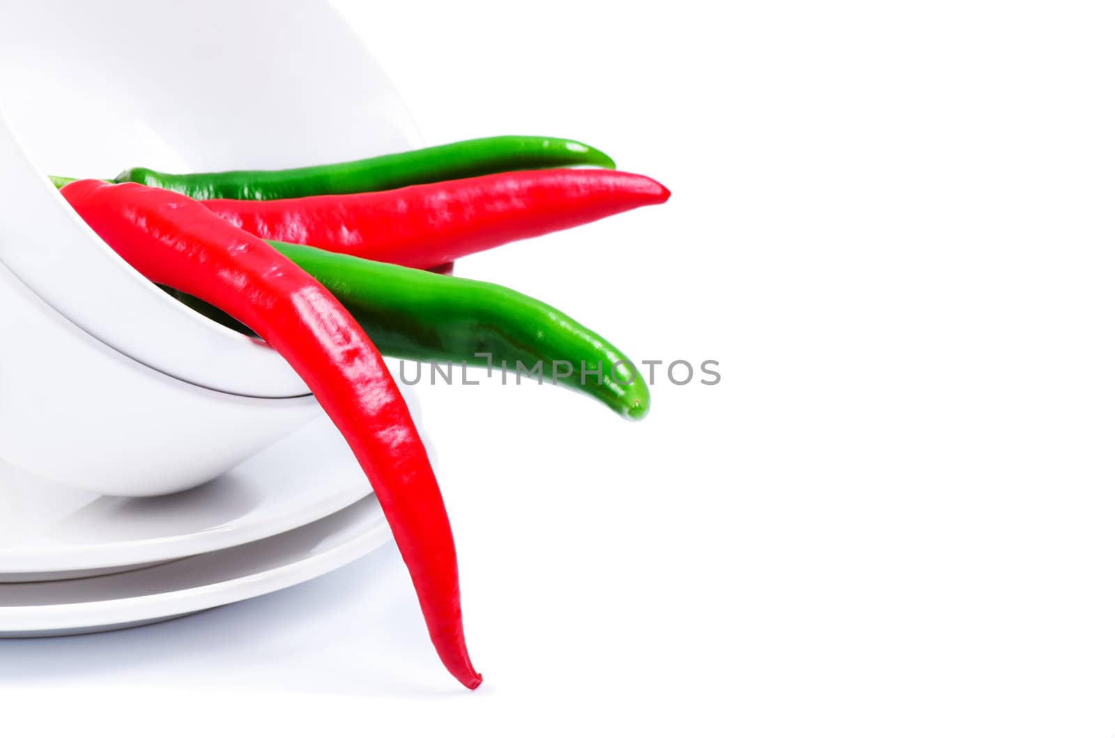 Chili peppers in bowl  close up isolated