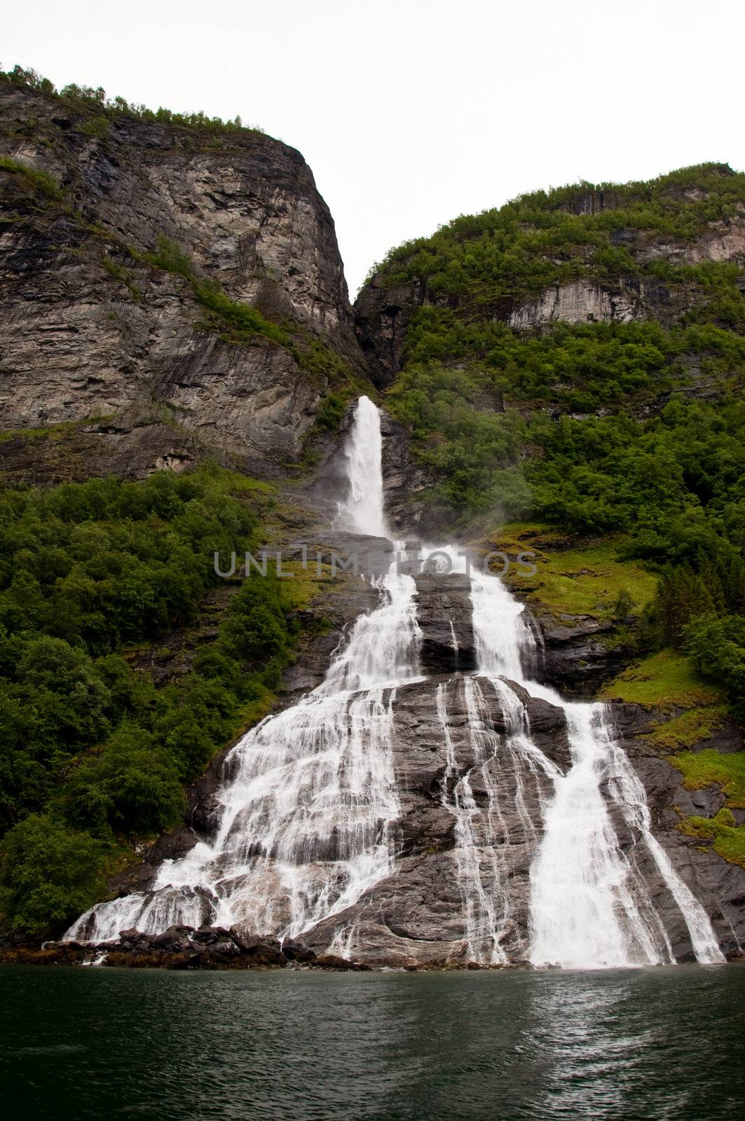 Big waterfall at geirangerfjord by Nanisimova