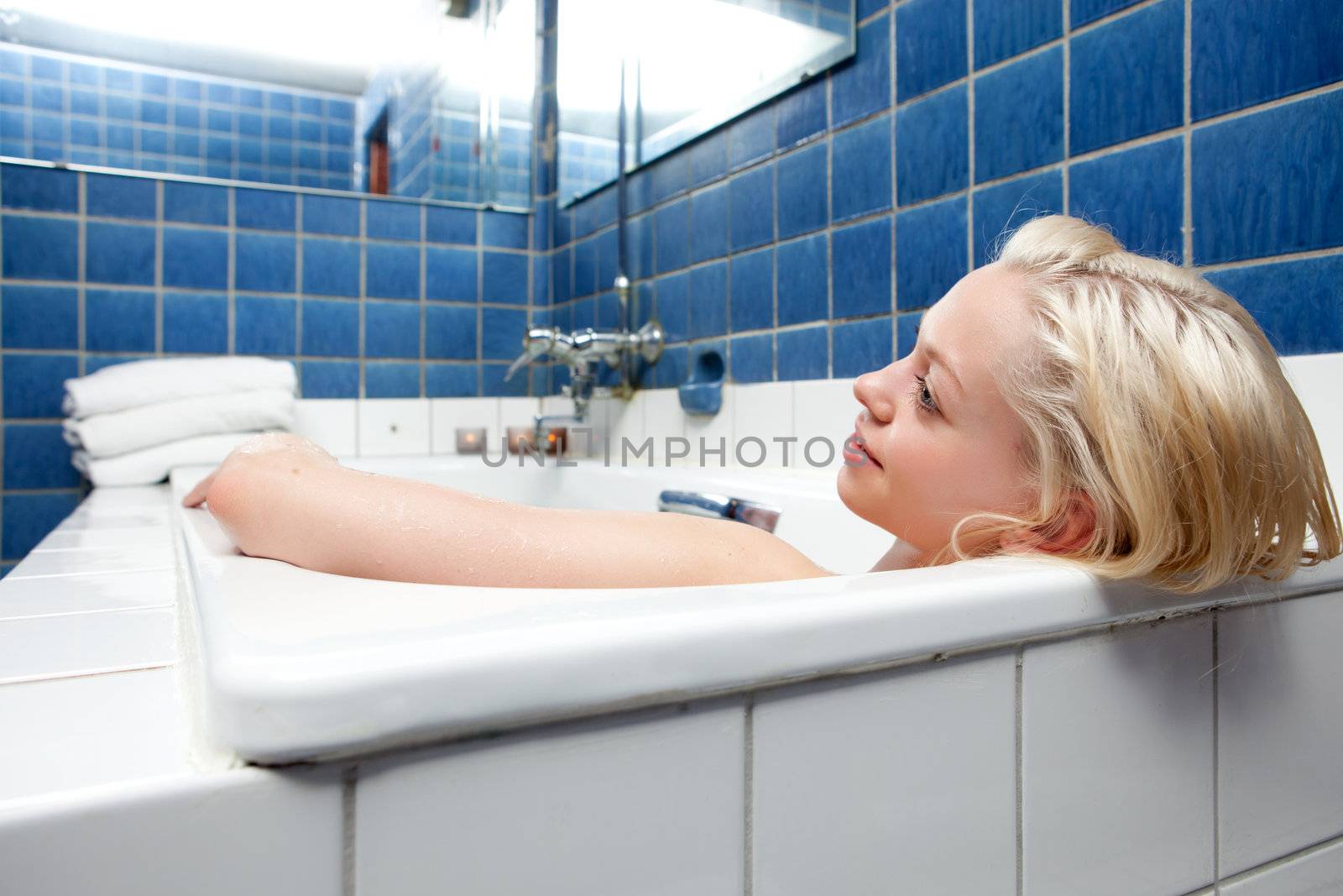 Beautiful Blonde Woman in Bath by leaf