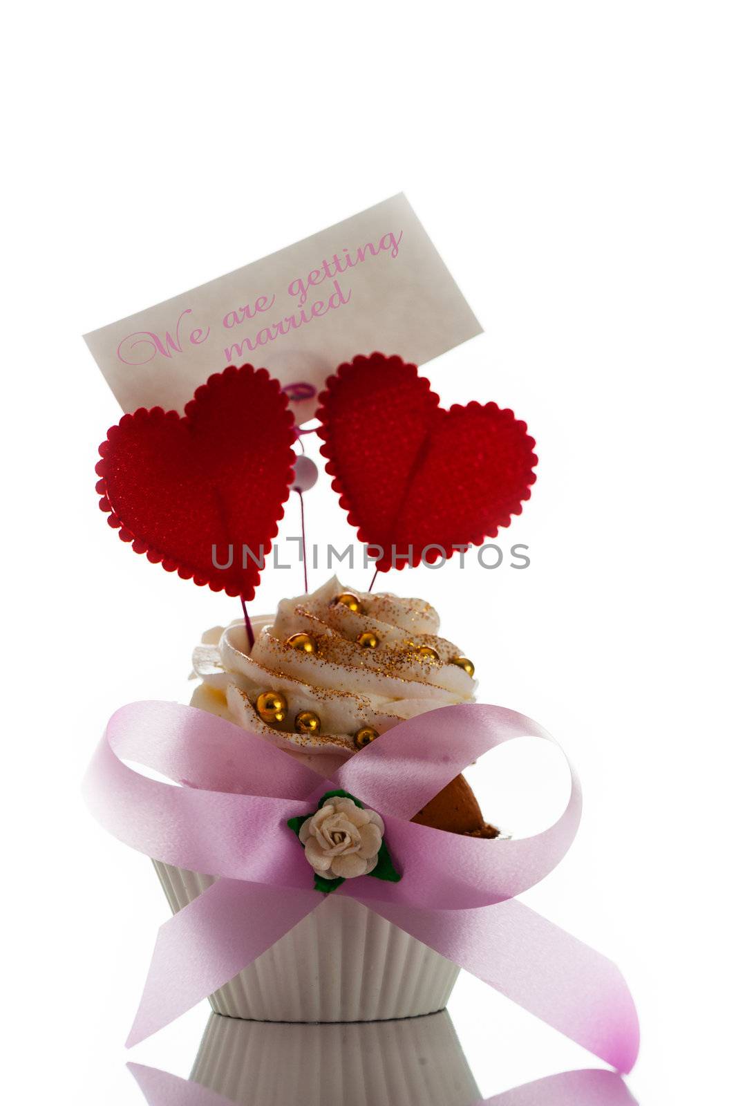 Wedding invitation card with cupcake two heart  on white background as a studio shot