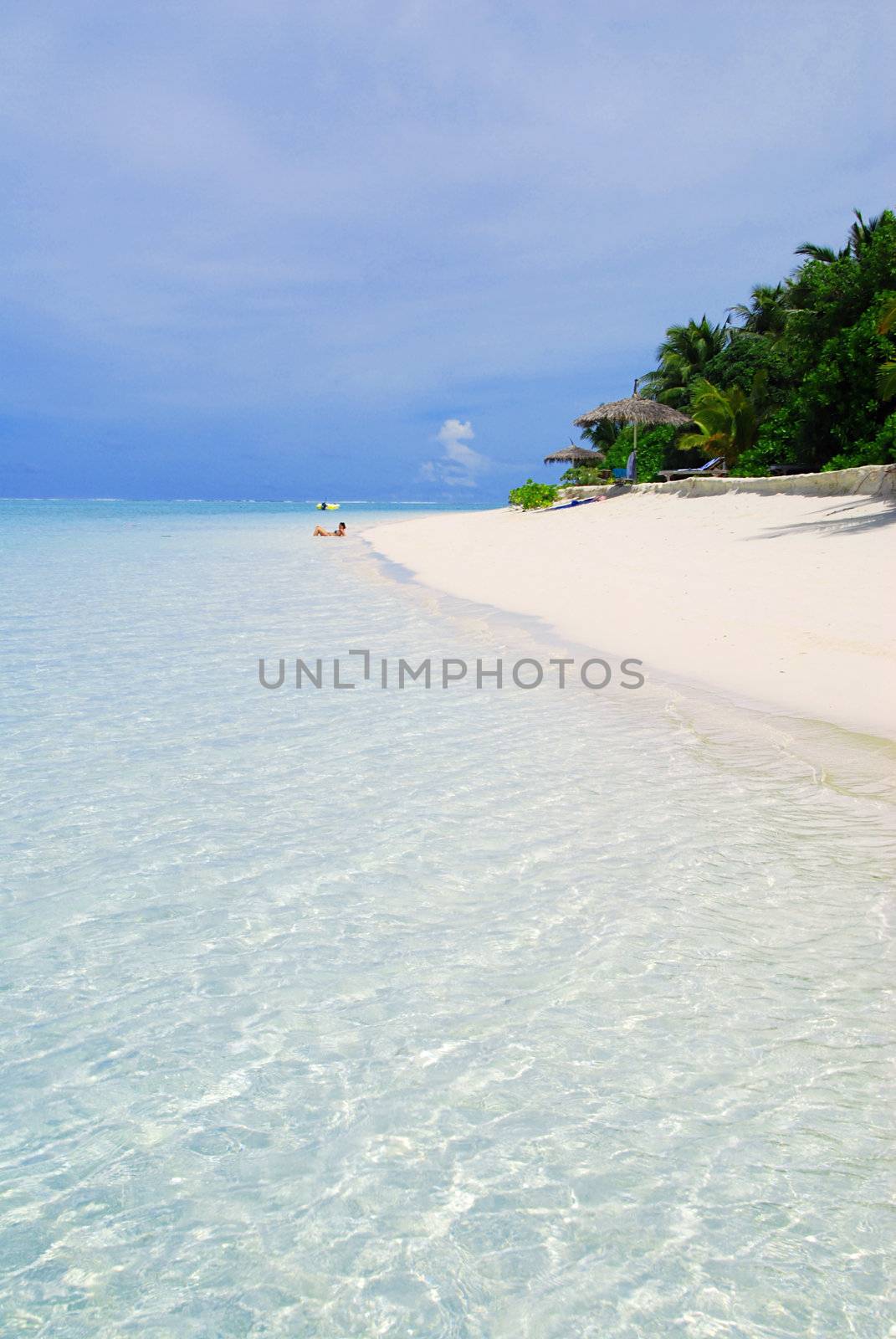 Beautiful tropical beach with turquoise sea, white sand and palm